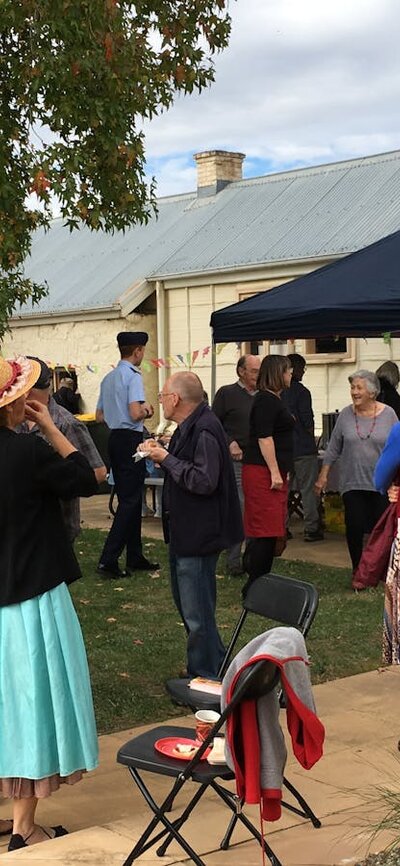 Enjoy many activities at our open day. Crowd of people standing outdoors with building in background