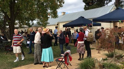 Enjoy many activities at our open day. Crowd of people standing outdoors with building in background
