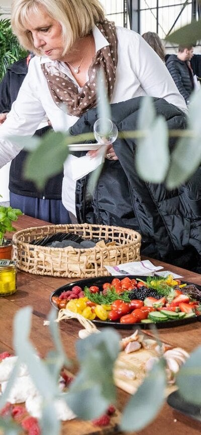 Lady eating providore snacks at the National Wine Experience