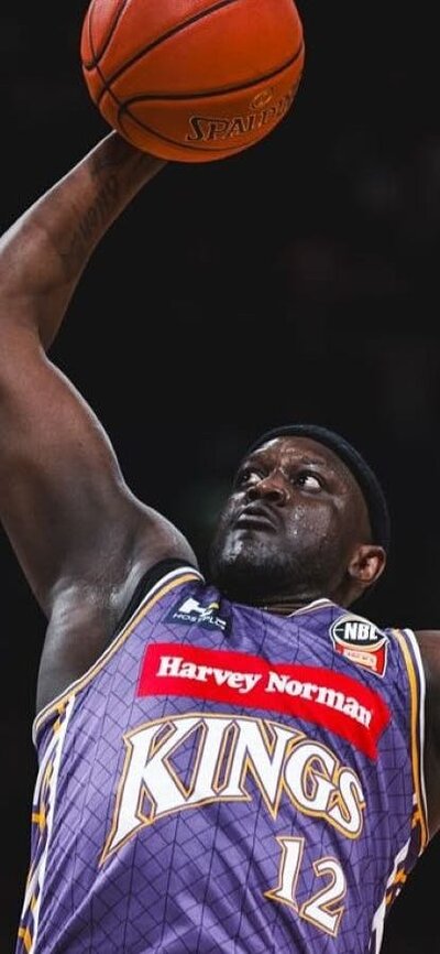Sydney Kings player and opponent on court