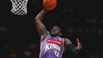 Sydney Kings player and opponent on court