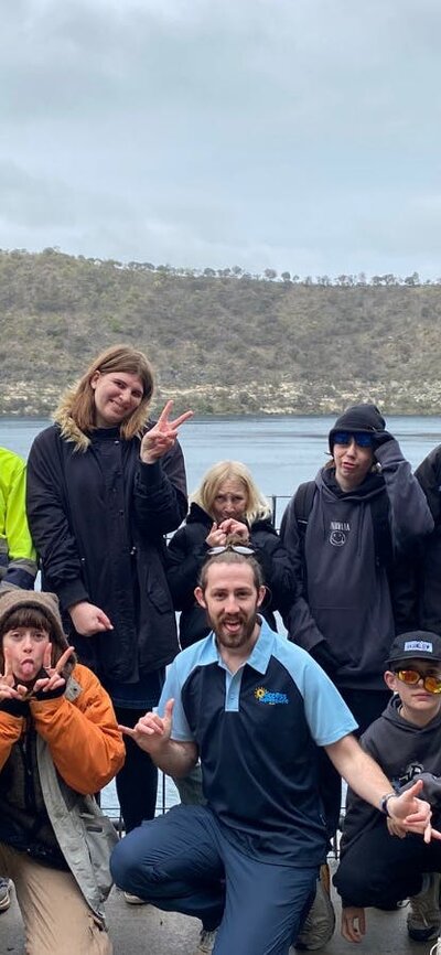 Access Adventure Club staff and participants smiling together in a group photo