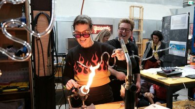 Artist Harriet Schwarzrock bending neon at Canberra Glassworks Neon bending at Canberra Glassworks