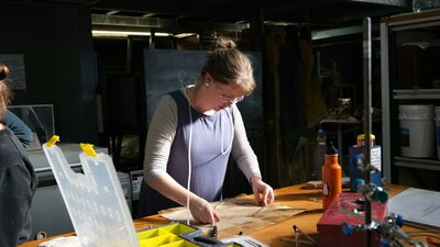Artist Rose-Mary Faulkner bending Neon at Canberra Glassworks Neon bending