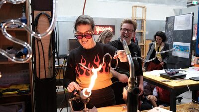 Artist Harriet Schwarzrock bending neon at Canberra Glassworks Neon bending at Canberra Glassworks