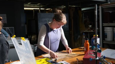 Artist Rose-Mary Faulkner bending Neon at Canberra Glassworks Neon bending