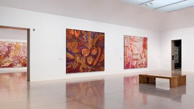 Installation view of large and colourful first nation's works
