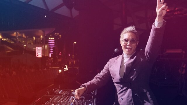 SBS PopAsia’s Andy Trieu Andy Trieu doing a live DJ set on stage doing a peace sign