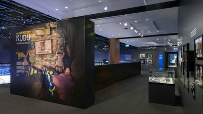 entrance to the gallery with main photo of solider with arms crossed