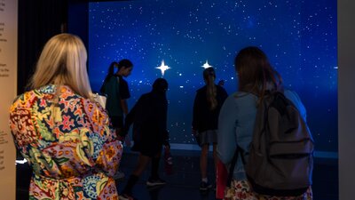 Young people interacting with Gravitational Weave at Outer Space