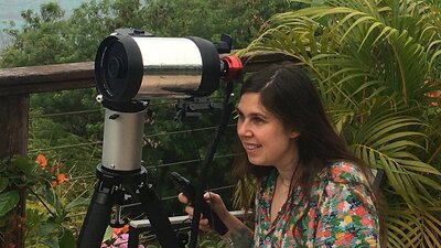 Dr Karelle Siellez is operating an outdoor telescope