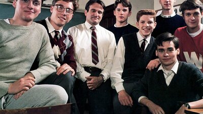 Group of young men with a teacher posing for a group photo