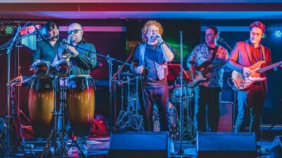 Picture Book - Simply Red tribute band  performing. Singer, percussion, guitar, bass.
