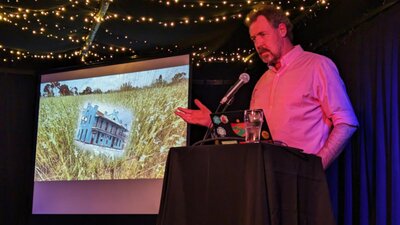 Pint AU Speaker, Adelaide Scientist presenting their research to an audience, at Adelaide Pint AU event.