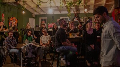 Pint of Science Australia x National Science Week 2025. A speaker addressing a bar full of people