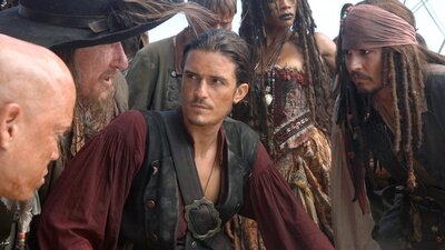 Pirates and others crowded together in deep conversation and listening
