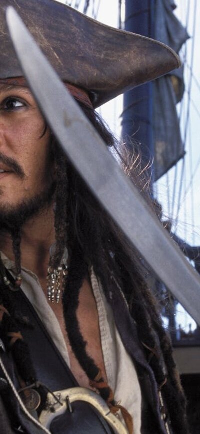 Pirates of the Caribbean: The Curse of the Black Pearl (2003 | M ) Pirate on a ship with another man pointing a sword to the left of the camera