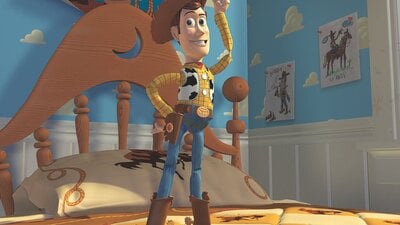 Animated still from Toy Story showing Woody, a toy cowboy