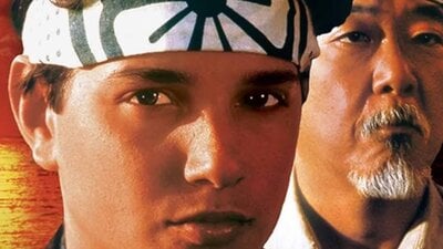 Promotional image for The Karate Kid showing portraits of a boy and a man in front of sunset