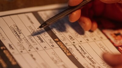 Trivia answer sheet with pen