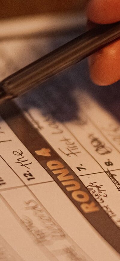 Trivia answer sheet with pen