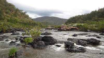 The Murrumbidgee River A picture of a waterwatch with rocks and hills in the background