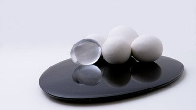 Spheres of different materials placed on top a slate of glass.