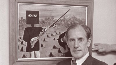 Sidney Nolan posed in front of a Ned Kelly painting for Pix Magazine