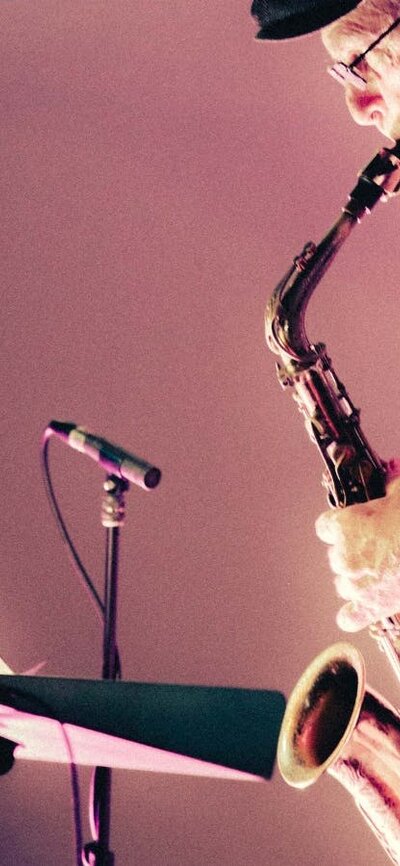 Pictured is Phillip Johnston performing with his saxophone