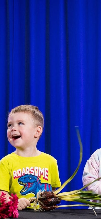 Two children learn about flowers at Science Time: Spring