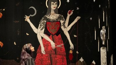 Tal Fitzpatrick | Quietly Seething: Fate, Fury and Transmutation Image of a textile artwork showing a woman standing in a red dress and six arms