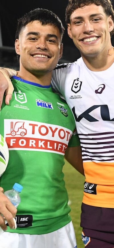 Matt Timoko and Jordan Riki after the Broncos' last game in Canberra in 2023.