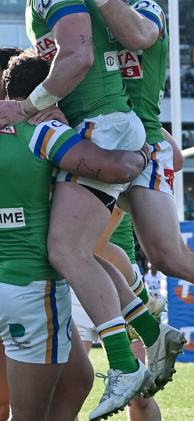 Canberra Raiders players celebrating a try.