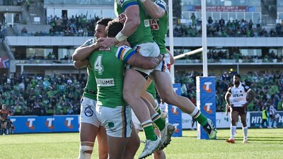 Canberra Raiders players celebrating a try.