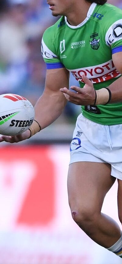 Canberra Raiders player Kaeo Weekes passing the ball.