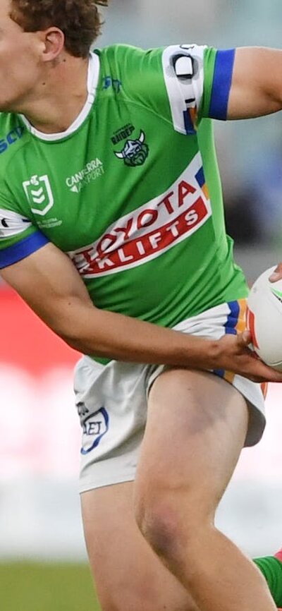 Canberra Raiders player Owen Pattie passing the ball.