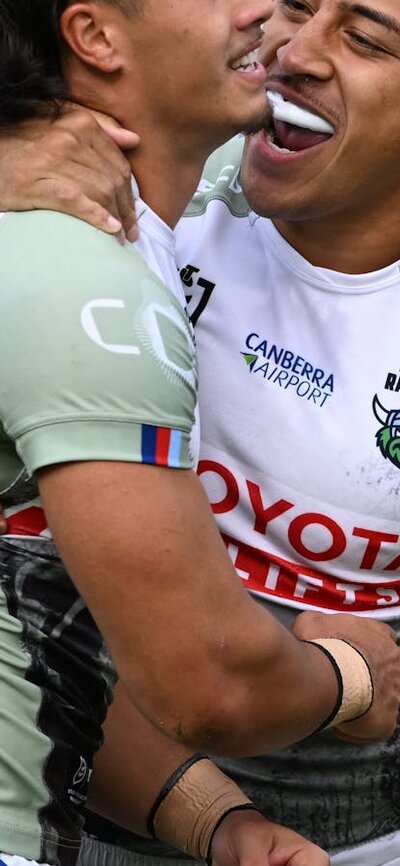 Canberra Raiders players Ata Mariota and Kaeo Weekes celebrating.