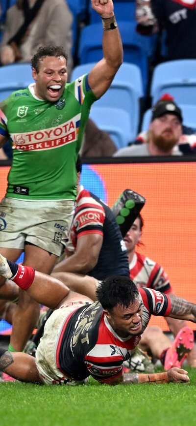 Canberra Raiders player Hudson Young scoring a try as Sebastian Kris celebrates.
