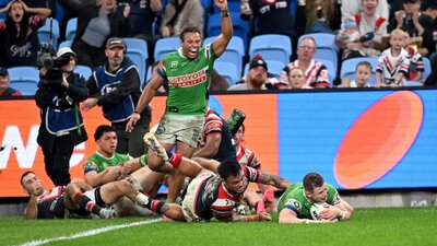 Canberra Raiders player Hudson Young scoring a try as Sebastian Kris celebrates.