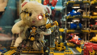 Closeup image of RELICS exhibition with vintage teddy bear and LEGO® elements