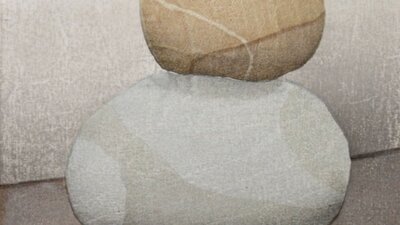 A gentle woodblock print of some stones sitting on top of each other.
