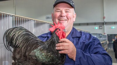 Royal Canberra Poultry Show exhibitor with his chicken