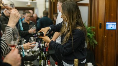lady pouring wine
