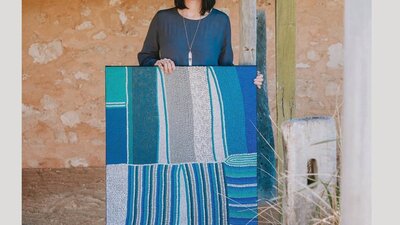 Amanda Westley with a large contemporary dot style painting