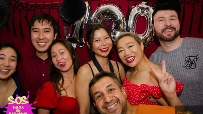 Group of people at the Photo Booth during SOS 100th event