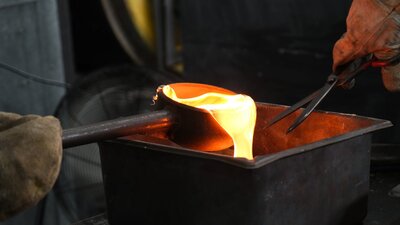 sandcasting ladle of hot glass