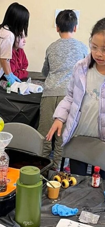 Children participating in chemistry science experiment