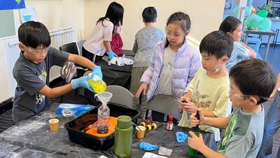Children participating in chemistry science experiment
