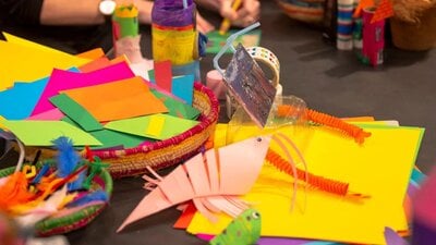 A colour array of crafting materials including paper and pipe cleaners