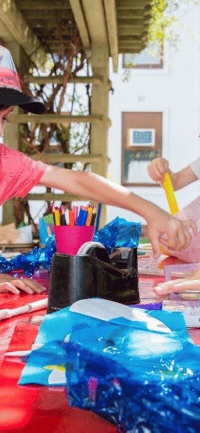 Children at MoAD doing craft activities outside